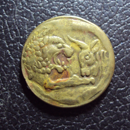 Жетон в виде античной монеты.